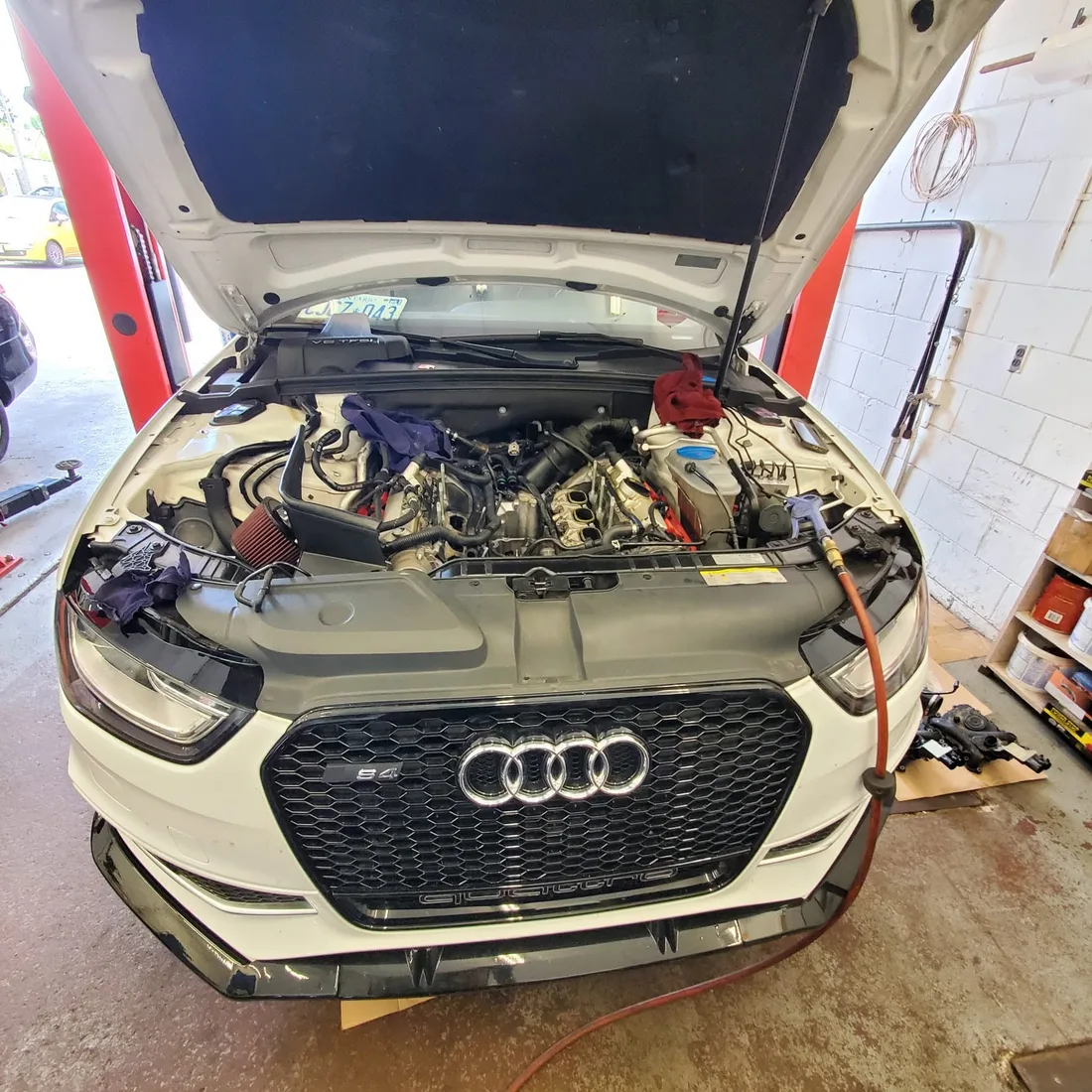 White Audi S4 in a service bay at JK Motors